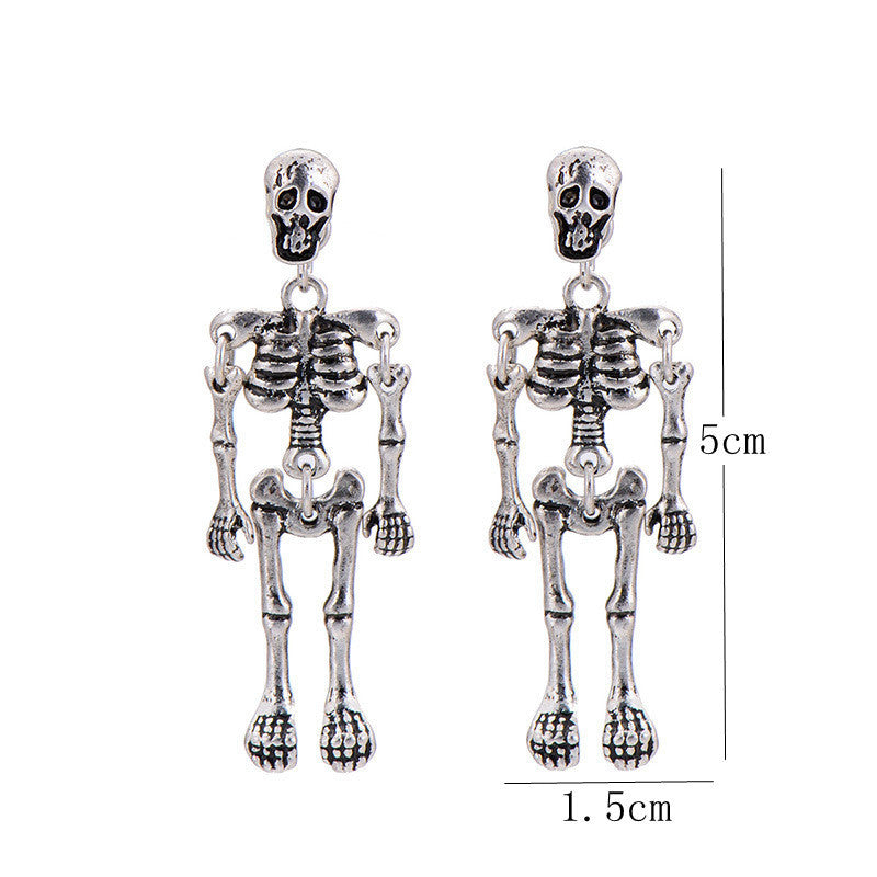 A pair of playful small stud earrings with movable hands and feet of punk INS skull
